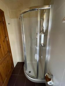 a shower with a glass door in a bathroom at Gilju B&B in Tal-Barmil +28 photos