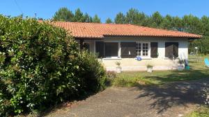 a small white house with an orange roof at Cool Landes in Sainte-Eulalie-en-Born +14 photos