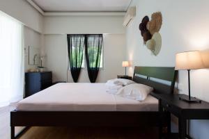 Cama ou camas em um quarto em Lovely Apartment in Athens-Psychiko