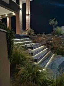 a set of stairs in a building with plants at Thetis Boutique Apartments in Neos Marmaras