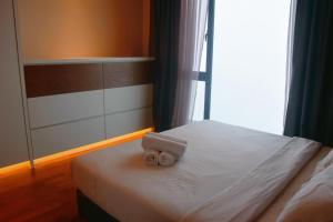 Postel nebo postele na pokoji v ubytování Humble Abode Friends Suite 2-4pax Geo38 Genting Free WiFi