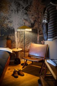 a bedroom with a bed and a chair and a table at Urbn Dreams II in Berlin