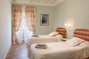 Un ou plusieurs lits dans un hébergement de l'établissement Tuscan farmhouse with spectacular views