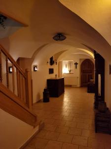 a hallway of a church with a cross on the wall at Haus Fiegl in Oetz