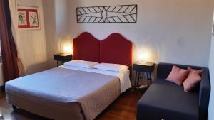 Postel nebo postele na pokoji v ubytování Albergo Moderno