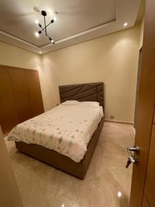 a bedroom with a bed in a room at CASA BAY BEACH OMK in Sidi Rahal +6 photos
