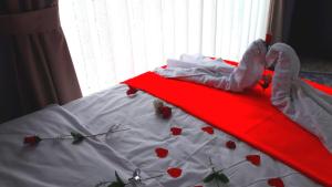 מיטה או מיטות בחדר ב-Yasin Apart hotel