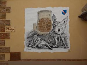 a drawing of two men on a wall at B&B Del Borgo in San Marco Argentano