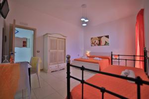 A bed or beds in a room at Meraviglie del Salento