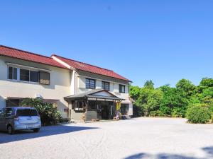 a car parked in front of a building at Kami - Hotel / Vacation STAY 15951 in Kami