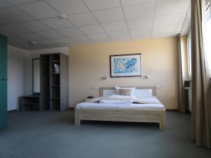Giường trong phòng chung tại Businesshotel & Appartements Stuttgart-Vaihingen