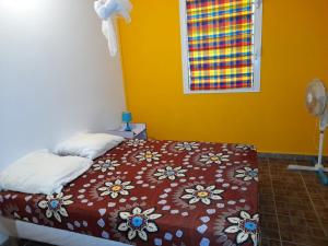 Ένα ή περισσότερα κρεβάτια σε δωμάτιο στο Appartement confortable à Capesterre 60 m² vue mer
