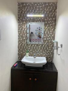 Ett badrum på Golden Peacock Heritage Home Stay