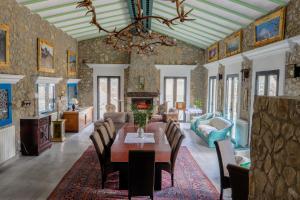 a dining room with a table and chairs at Molino Sauco - Hammam in Puebla de Don Fadrique