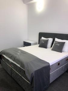 Postel nebo postele na pokoji v ubytování Hotel Daly