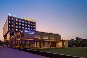 a building with a sign on the side of it at Wyndham Chandigarh Mohali in Chandīgarh