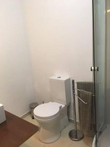 a white bathroom with a toilet and a shower at Charming Suite Private Wc & Balcony in Lisbon