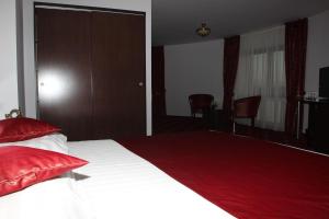 Postel nebo postele na pokoji v ubytování Hotel Royal 2
