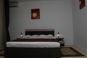 Postel nebo postele na pokoji v ubytování Hotel Royal 2