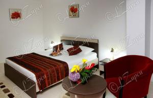 Postel nebo postele na pokoji v ubytování Hotel Royal 2