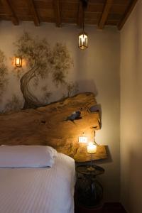 A bed or beds in a room at Villa Maria - b&b di Charme