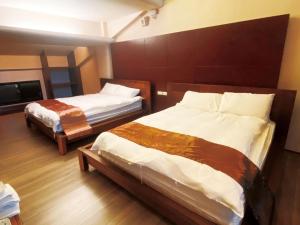 Letto o letti in una camera di 礁溪景觀溫泉會館