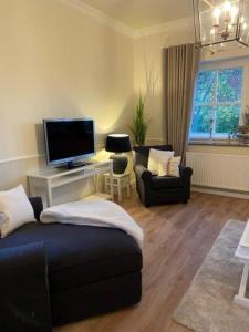 TV a/nebo společenská místnost v ubytování Hotel Hof Holm