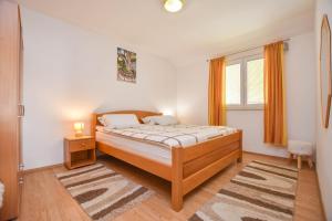Posteľ alebo postele v izbe v ubytovaní Apartments Dandelion