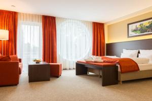 Postel nebo postele na pokoji v ubytování Aribo Hotel