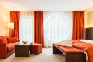 Postel nebo postele na pokoji v ubytování Aribo Hotel