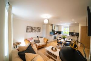 a living room with a couch and a table at Foundry Farm Cottage in Hexham