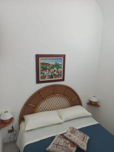Postel nebo postele na pokoji v ubytování CASETTA PONENTE