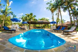 בריכת השחייה שנמצאת ב-Cabanas Termas Hotel או באזור
