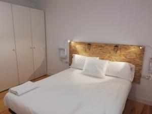 Łóżko lub łóżka w pokoju w obiekcie Calle Carmen Céntrico Amplio