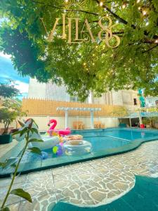 a pool at a hotel with a sign that reads halo at Villa 86 in Ho Chi Minh City