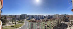 arial view of a city with buildings and a street at Blue Bay Apartment in Setúbal