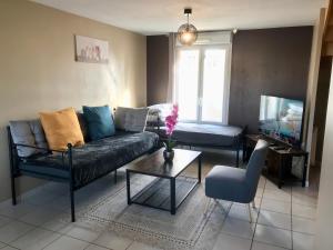 Posezení v ubytování Agréable maison proche Gare avec parking gratuit