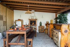 a dining room with a table and wooden furniture at Akivillas Setúbal Paradise in Setúbal