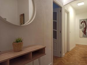 a hallway with a mirror on the wall at Apartamento marrodan centrico in Arnedillo +1 photo
