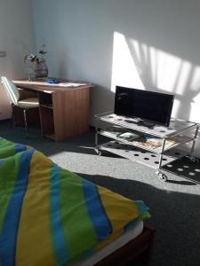 Televízia a/alebo spoločenská miestnosť v ubytovaní Apartments Da - Dent