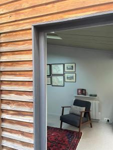 a room with a sliding glass door with a chair at Maison exceptionnelle, Campagne a Paris in Paris