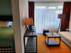 Postel nebo postele na pokoji v ubytování Badhotel Bruin