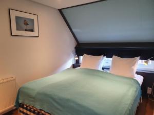 Postel nebo postele na pokoji v ubytování Badhotel Bruin