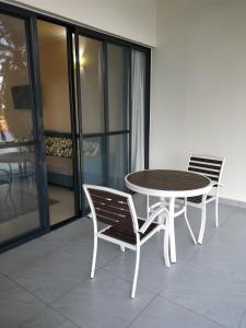 two chairs and a table on a balcony at Lake Kariba Inns in Siavonga