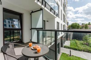 En balkon eller terrasse på Warsaw City Comfort Apartments