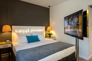 Postel nebo postele na pokoji v ubytování Prima City Hotel