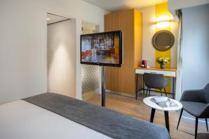 Postel nebo postele na pokoji v ubytování Prima City Hotel