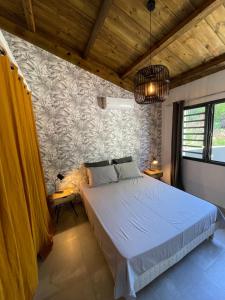 Giường trong phòng chung tại villa Pwintosel 2
