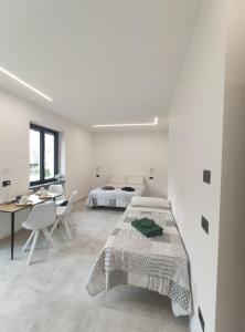 Letto o letti in una camera di A, C or D - MyAostaProject Rentals