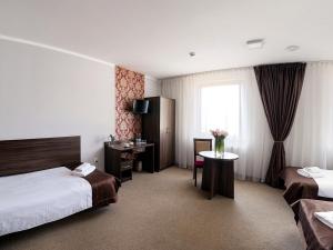 Posteľ alebo postele v izbe v ubytovaní Hotel Dąbrowski